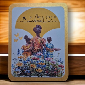 Muttertagskarte Goldhintergrund Muttertagskarte Goldhintergrund mit Aufdruck „Schwarze Frau und Kinder“.