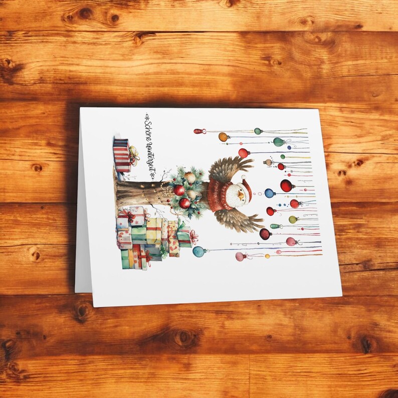 May include: A white card with a watercolor illustration of an owl with a red Santa hat, holding ornaments on a tree with presents underneath. The text "*Schone Weihnachtszeit*" is printed on the card.