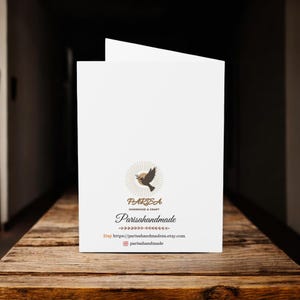 May include: A white card with a brown dove logo and the text "PARISA Handmade & Craft" and "Parisahandmade". The text "Etsy" and a website address are also included.