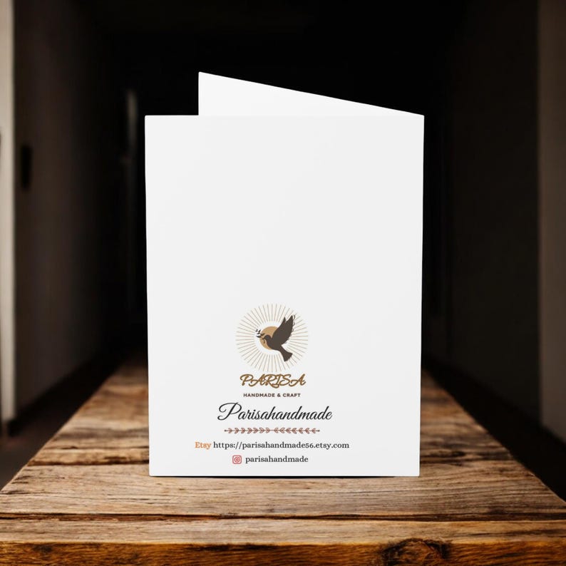 May include: A white card with a brown dove logo and the text "PARISA Handmade & Craft" and "Parisahandmade". The text "Etsy" and a website address are also included.