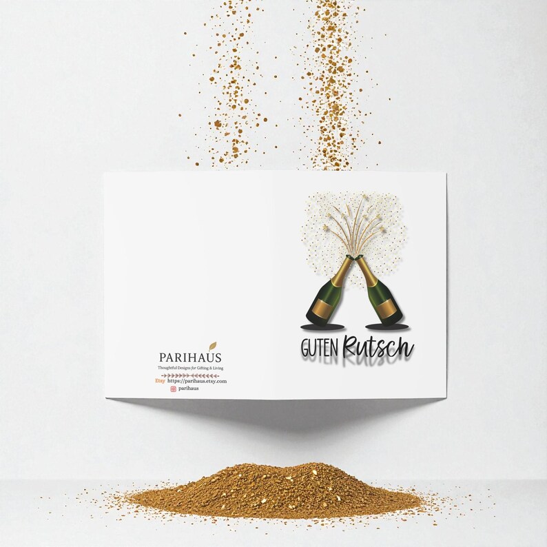 May include: A white greeting card with a gold and green champagne bottle design. The card has the words "Guten Rutsch" and "Parihaus" printed on it. Gold confetti is scattered around the card.