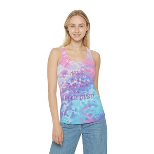 May include: A tie-dye tank top with a pink, blue, and purple color scheme. The tank top has a racerback style and features the text "All you need is Faith, Trust and... PIXIE DUST!" in pink lettering.