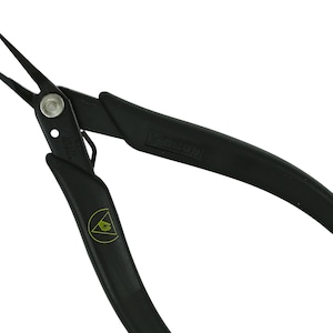 May include: Black flush cutters with a yellow triangle logo. The cutters have black handles and a silver head.