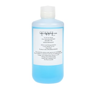 May include: A clear plastic bottle with a blue liquid inside. The bottle is labeled with the text "Technology Without Limits" and the company name "TWL". The label also includes the company's address, phone number, and website. The product is a 1 liter bottle of Rose Gold plating solution.