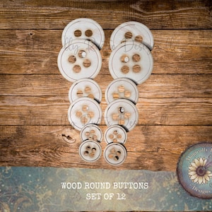 May include: A set of 12 wood round buttons in various sizes, arranged on a wooden surface. The buttons have a light, natural wood color with visible grain and hole patterns. The text "WOOD ROUND BUTTONS SET OF 12" is visible.