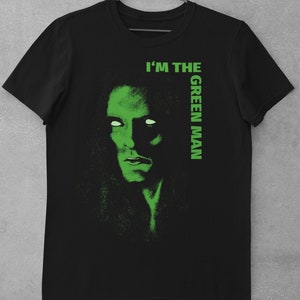 May include: Black t-shirt with a green graphic of a man's face and the text "I'm the Green Man".