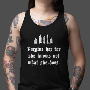 May include: Black tank top with a white graphic of five candles and the text "Forgive her for she knows not what she does."