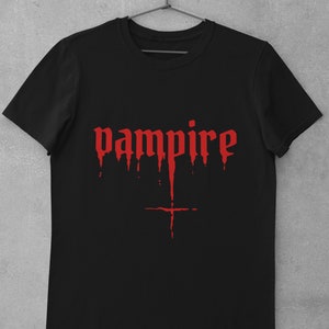 May include: Black t-shirt with a red dripping "vampire" graphic.