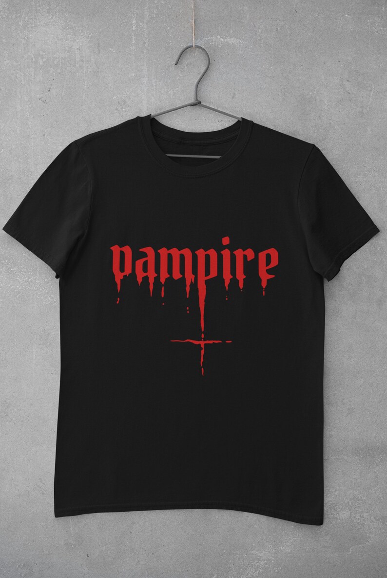 May include: Black t-shirt with a red dripping "vampire" graphic.