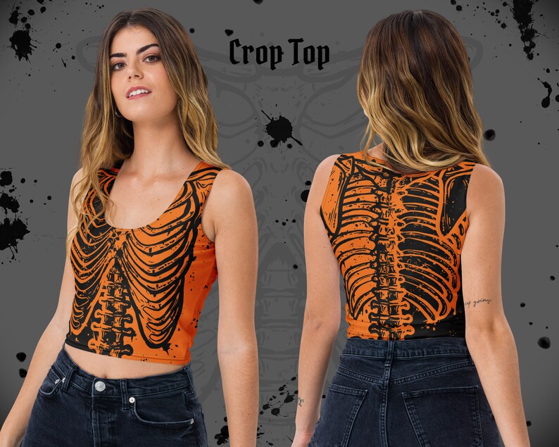 May include: Orange crop top with a black skeleton print. The top is sleeveless and has a scoop neck.