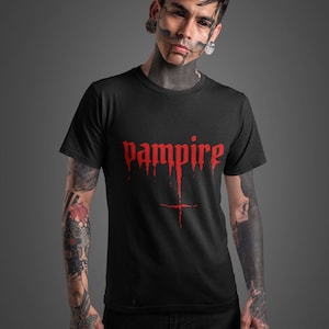 May include: Black t-shirt with a red "vampire" graphic with dripping blood and a cross underneath.