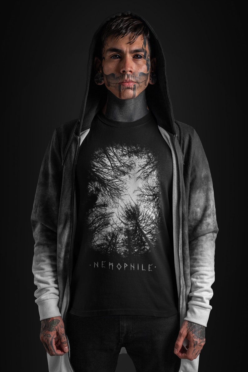 May include: A black hooded sweatshirt with a white graphic print of a forest on the front. The graphic print includes the text ".NEMOPHILE."