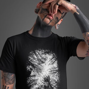 May include: Black t-shirt with a white graphic print of a forest scene. The text "NEMOPHILE." is printed below the graphic.