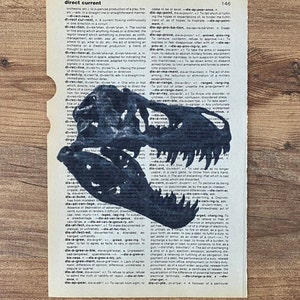 May include: A black and white illustration of a dinosaur skull is silhouetted on a vintage dictionary page. The image is a unique blend of art and literature, perfect for a home decor item.