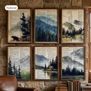May include: Six framed art prints featuring watercolor landscapes of forests, mountains, and a cabin, each printed over vintage dictionary pages with visible text columns. The artwork displays various shades of green, blue, and brown tones.