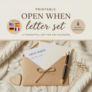 May include: A printable open when letter set featuring a brown envelope tied with twine, a white card with the text OPEN WHEN YOU'RE SAD, a blank cream-colored card, a black fountain pen, and a small wooden heart shape on a white knit fabric.