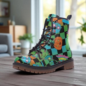 May include: A colorful combat boot featuring a checkerboard pattern in green, black, and blue. The boot is adorned with cartoon-style illustrations in orange, pink, and teal. It has black laces and a brown sole.