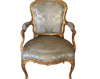 A Pair Of Louis XV Giltwood Fauteuils