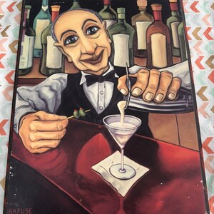 May include: A painted wooden bar scene featuring a bartender pouring a martini. The artwork includes a smiling bartender, a martini glass, olives, and bottles of liquor in the background. The artist's signature, "RAFUSE", is visible.