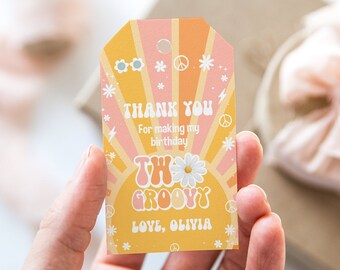 May include: A yellow and pink thank you tag with a sunburst design and the text "Thank you for making my birthday two groovy. Love, Olivia."