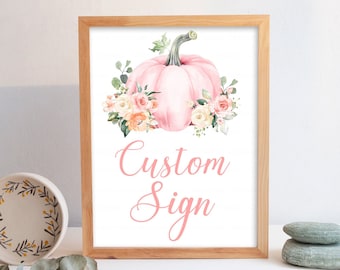 May include: A printable sign with a pink pumpkin and floral accents. The text on the sign reads "Custom Sign".