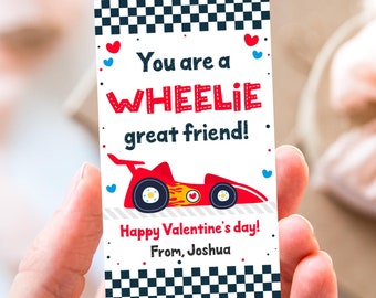 May include: A red and white Valentine's Day card with a cartoon race car and the text "You are a WHEELIE great friend! Happy Valentine's day! From, Joshua."