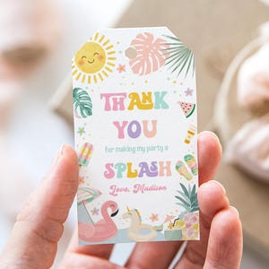 May include: A white gift tag with a summer theme. The tag features a smiling sun, tropical leaves, and the words "THANK YOU for making my party a SPLASH". A pink flamingo and a unicorn floatie are also shown.