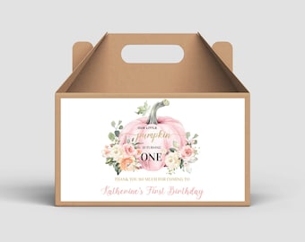 May include: A pink pumpkin with a gold inscription "Our Little Pumpkin is Turning One" surrounded by watercolor flowers. The text "Thank you so much for coming to Katherine's First Birthday" is below the pumpkin. The image is on a brown favor box.