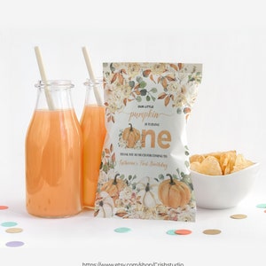 May include: A white chip bag with a autumn-themed design featuring pumpkins, flowers, and leaves. The bag has text that reads "Our little pumpkin is turning one" and "Thank you so much for coming to Katherine's First Birthday".