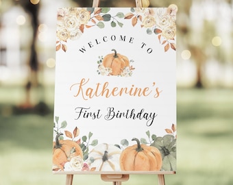 May include: Welcome to Katherine's First Birthday sign with a watercolor pumpkin and floral design.