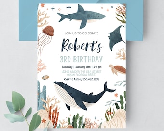 May include: A white invitation with a blue whale, shark, and jellyfish. The invitation is for Robert's 3rd birthday party. The party is on Saturday, January 18th from 2-4 pm at 12345 Under the Sea Street, Miami Florida 88877. RSVP to Ashley at 555.432.1098.
