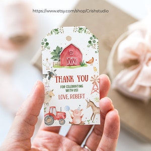 May include: A white thank you tag with a red barn, farm animals, and a tractor. The text reads "Thank you for celebrating with us! Love, Robert."