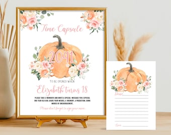 Op de afbeelding: Een printbaar tijdcapsule-bord met een pompoen- en bloemendesign. Het bord zegt "Time Capsule 2041" en "Te openen wanneer Elizabeth 18 jaar wordt". Het bevat instructies om een speciale boodschap voor een eenjarig meisje te schrijven.