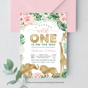 May include: A baby shower invitation with a jungle theme. The invitation features the text "A Little Wild One Is On The Way" in pink and gold. Gold animal silhouettes of an elephant, lion, giraffe, and monkey are included.