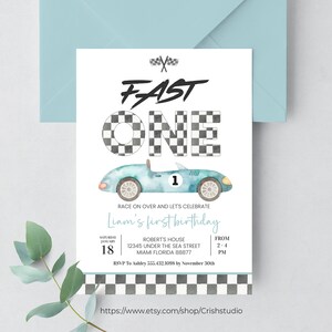 May include: A blue and white race car themed first birthday invitation with a watercolor illustration of a blue race car with a checkered flag pattern. The invitation says "Fast One" and includes the text "Race on over and let's celebrate Liam's first birthday".