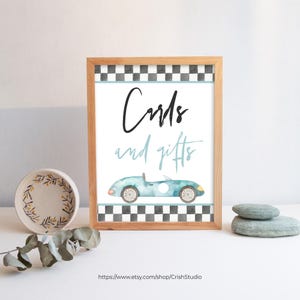 May include: A printable sign with a black and white checkered border. The sign says "Cards and gifts" in black text with a blue watercolor car illustration.