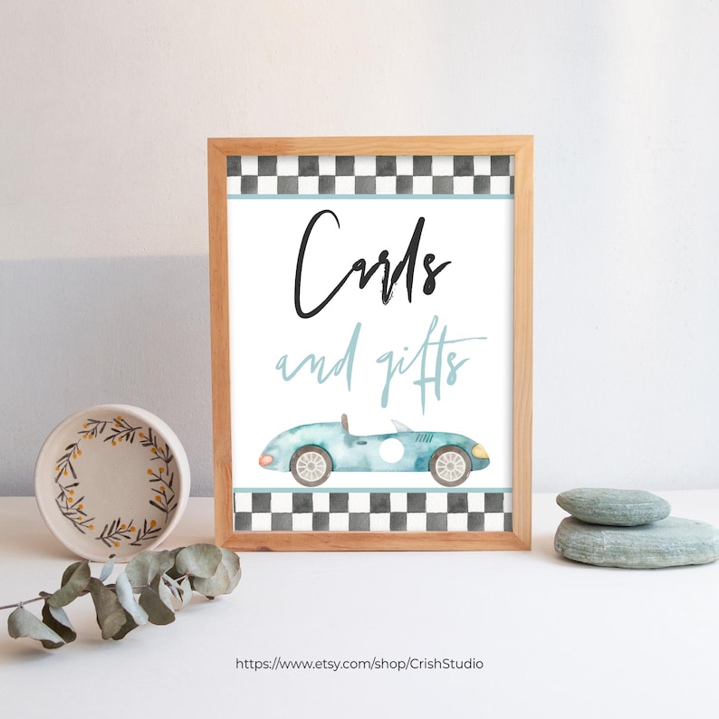 May include: A printable sign with a black and white checkered border. The sign says "Cards and gifts" in black text with a blue watercolor car illustration.