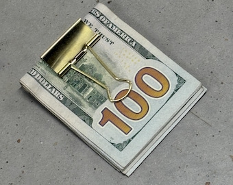 Clip para carpeta de billetes en tono dorado