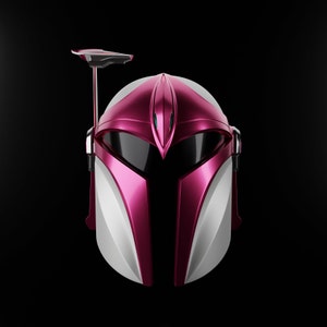 May include: A pink and white helmet with a visor and a small antenna on top. The helmet has a futuristic design.