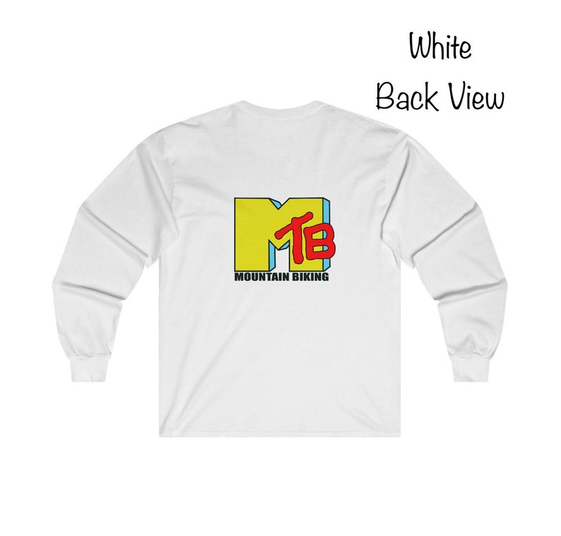 May include: White long-sleeve t-shirt with a yellow, blue, and red "MTB" logo and the text "Mountain Biking" printed on the back.