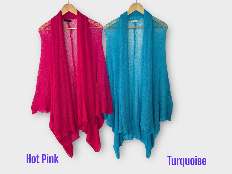 May include: Two open-front cardigans in hot pink and turquoise hang on wooden hangers. The cardigans are made of a lightweight, sheer fabric. The words "Hot Pink" and "Turquoise" are written in purple text below each cardigan.
