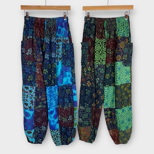 May include: Two pairs of patchwork pants with a drawstring waist. One pair is blue, green, and brown, and the other is green, blue, and brown.