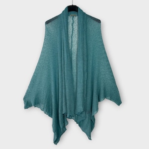 May include: A teal-colored open-front cardigan with a draped design, hanging on a black hanger. The lightweight knit fabric has a slightly textured appearance. The cardigan's asymmetrical hem adds a unique touch to this outerwear.