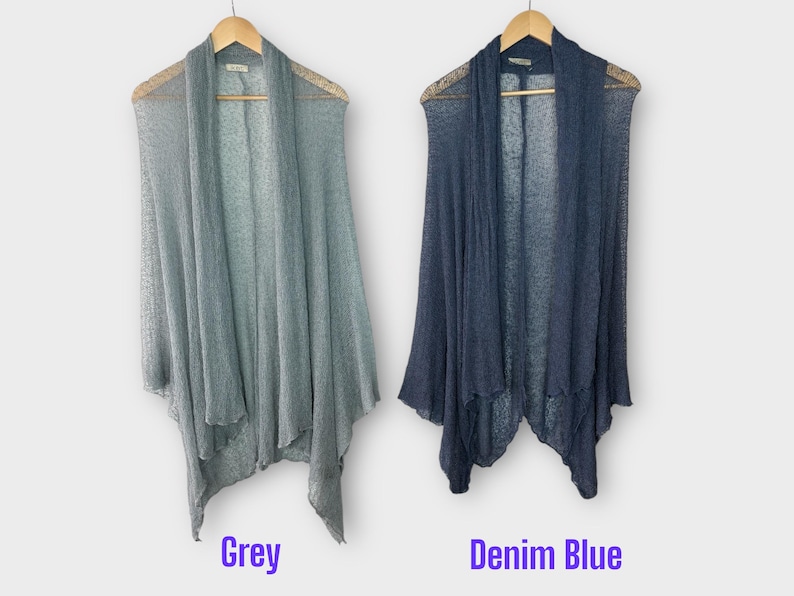 May include: Two open-front cardigans in grey and denim blue, displayed on wooden hangers. The grey cardigan is on the left, and the denim blue cardigan is on the right. The text "Grey" and "Denim Blue" are below each cardigan.