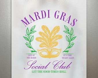 May include: A white t-shirt with a purple and green Mardi Gras design. The design features a gold mask with feathers, green leaves, and the text "Mardi Gras", "Life of the Mardi", "It's time to get jazzy", "Social Club", and "Let the good times roll".