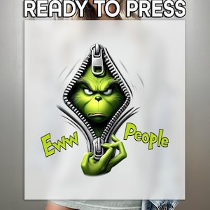 May include: A white t-shirt with a green Grinch character peeking out of a zipper opening. The Grinch is holding the zipper pull and has a grumpy expression. The text "Eww People" is written on the shirt.
