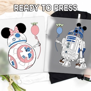 May include: Two iron-on transfers featuring Star Wars characters BB-8 and R2-D2. BB-8 is wearing a pink bow and holding a pink balloon. R2-D2 is wearing Mickey Mouse ears and holding a blue balloon. Both characters are holding balloons with a small green alien figure.
