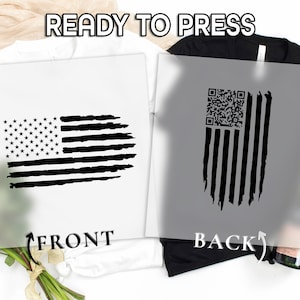 May include: Two white and black t-shirt designs with an American flag theme. One design shows the front of the flag, and the other shows the back of the flag with a QR code. The text "READY TO PRESS" is at the top.