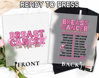 May include: White t-shirt with a pink graphic that says "BREAST CANCER The Fight Tour" on the front. The back of the shirt has a list of inspirational words and phrases in pink. The words "READY TO PRESS", "FRONT", and "BACK" are also visible.