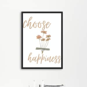 Peut inclure: Une impression d'art encadrée avec le texte choose en écriture cursive brun clair en haut et happiness dans la même écriture en bas. Entre les mots se trouve un petit bouquet de fleurs séchées rosées fixé par un morceau de ruban adhésif.